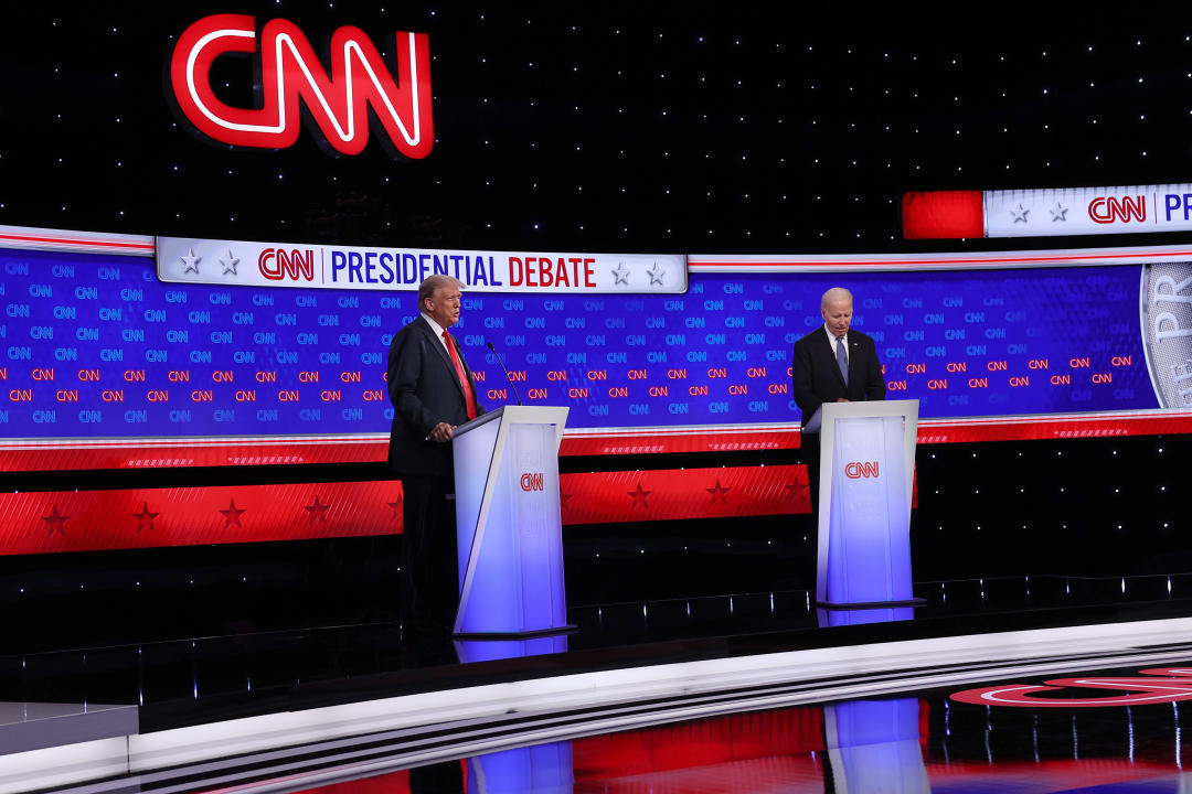 President Biden, right, and former President Donald Trump take the stage at Thursday's debate. (Justin Sullivan/Getty Images)