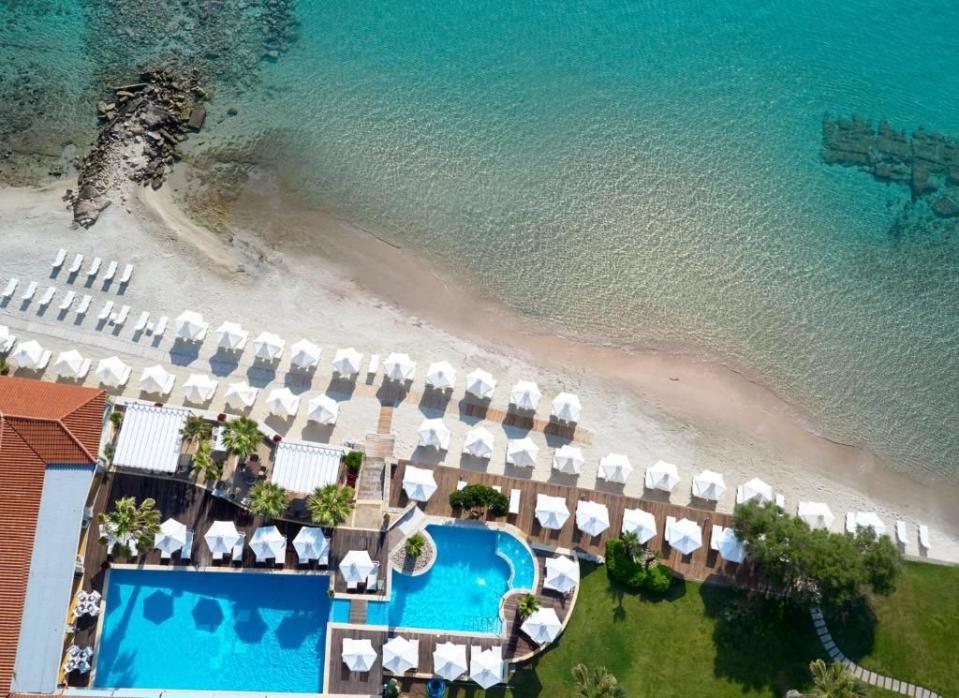 <p>On the westernmost fringes of Halkidiki peninsula, the <a href="https://www.booking.com/hotel/gr/afitis.en-gb.html?aid=1922306&label=best-hotels-greece" rel="nofollow noopener" target="_blank" data-ylk="slk:Afitis Boutique Hotel;elm:context_link;itc:0;sec:content-canvas" class="link ">Afitis Boutique Hotel</a> has been wooing visitors since it opened in 1969. A stylish Greek hotel with a rare private sandy beach, you can spend halcyon days lounging around the two palm-lined pools or paddling in the sea. However, it's well worth venturing out and exploring the nearby Petralona Cave and thermal springs, or having a long leisurely lunch in Afytos village, a short stroll away.</p><p>With just 50 rooms, this is far from a sprawling resort and is more intimate than most on the mainland. It offers good restaurants, Daphne and Mesogeios, both of which champion the region's home-grown produce. Rooms are serene and individually styled, some have a hint of the hotel's original 60s' vibe.</p><p><a class="link " href="https://www.booking.com/hotel/gr/afitis.en-gb.html?aid=1922306&label=best-hotels-greece" rel="nofollow noopener" target="_blank" data-ylk="slk:CHECK AVAILABILITY;elm:context_link;itc:0;sec:content-canvas">CHECK AVAILABILITY</a></p>