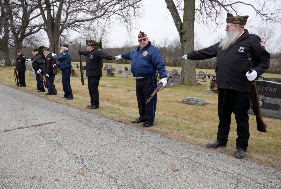 Members of VFW Post 4931, wearing black jackets, and American Legion Post 614, wearing blue jackets, space out as they line up as an honor guard for the funeral services of a Korean War veteran at Alton Cemetery in Galloway. Neither group sometimes has enough volunteers to provide a full honor guard by itself.