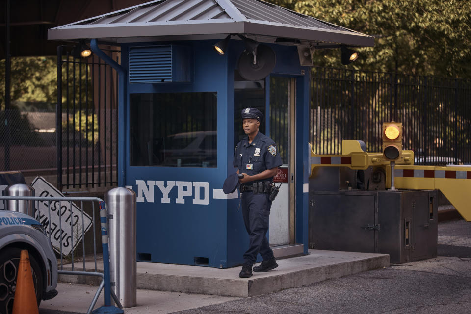 A police officer stands guard outside One Police Plaza NYPD Headquarters on Friday, Sept. 13, 2024, in New York. (AP Photo/Andres Kudacki)