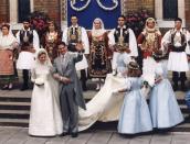 <p>Surrounded by traditional Greek dancers, Marie Chantal Miller and the exiled Crown Prince of Greece, Prince Pavlos, exit a London church after their wedding ceremony. Miller, the daughter of American businessman, Robert Miller, wore a silk and Chantilly lace wedding dress designed by Valentino. </p>