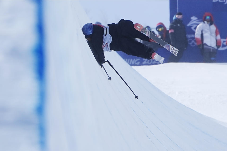 New Zealand's Nico Porteous falls during the men's halfpipe finals at the 2022 Winter Olympics, Saturday, Feb. 19, 2022, in Zhangjiakou, China. (AP Photo/Gregory Bull)