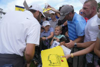 Scottie Scheffler signs autographs after a practice round for the PGA Championship golf tournament at the Valhalla Golf Club, Wednesday, May 15, 2024, in Louisville, Ky. (AP Photo/Sue Ogrocki)