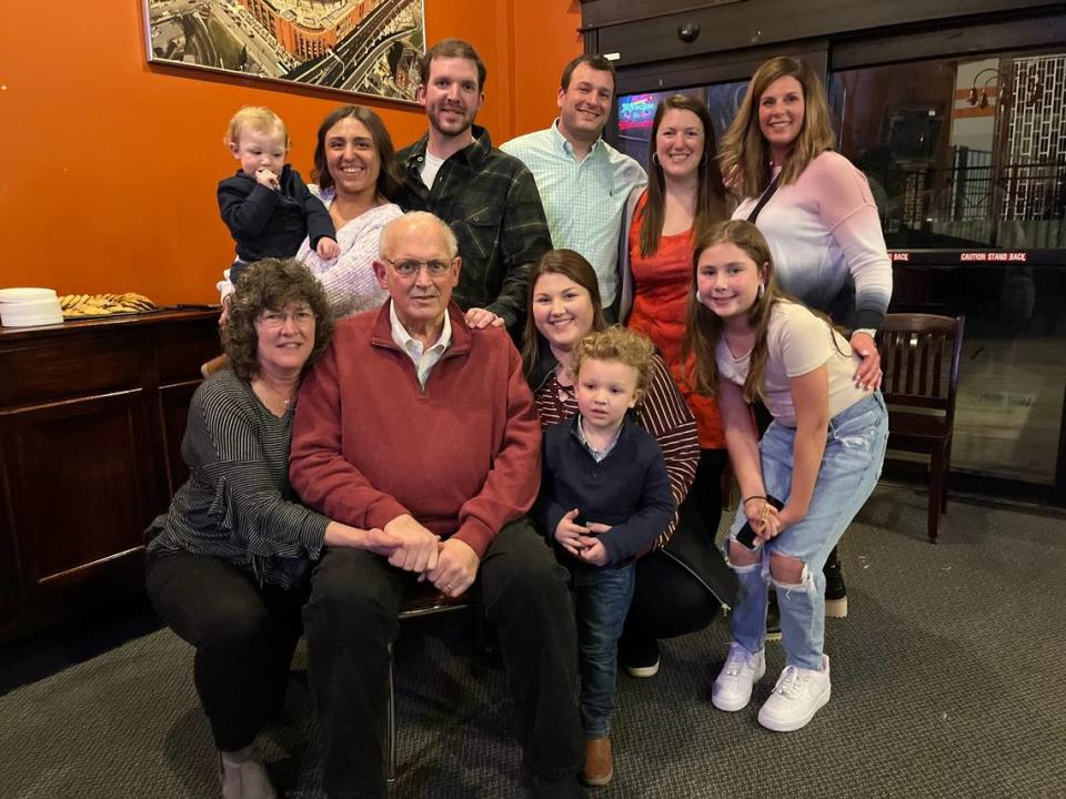 Former Belleville Mayor Mark Eckert, seated, and his wife, Rita Eckert, left, pose with family members at his 67th birthday party in January at Cutter’s Bar & Grill in Belleville.