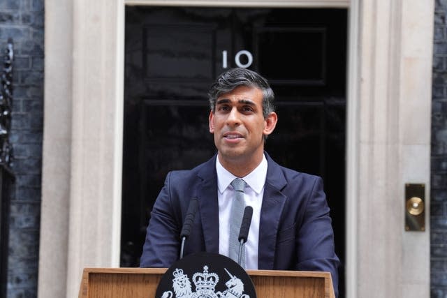 Rishi Sunak speaks at the lectern with the famous door of Number 10 behind him