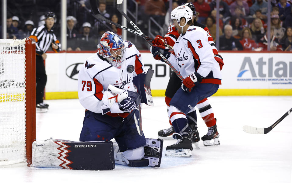 Washington Capitals goaltender Charlie Lindgren (79) makes a save against the New Jersey Devils during the second period of an NHL hockey game Friday, Nov. 10, 2023, in Newark, N.J. (AP Photo/Noah K. Murray)