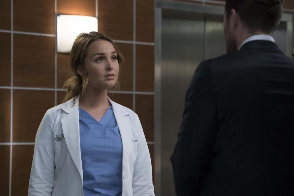 A still from Grey's Anatomy showing Dr Jo Wilson talking to a man outside an elevator