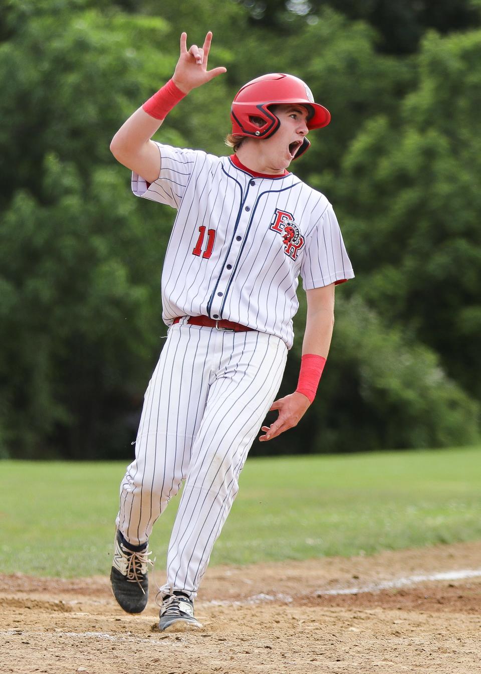 Bridgewater-Raynham's Owen King celebrates during a game in the Division 1 state tournament against Bishop Feehan on Monday, June 5, 2023.