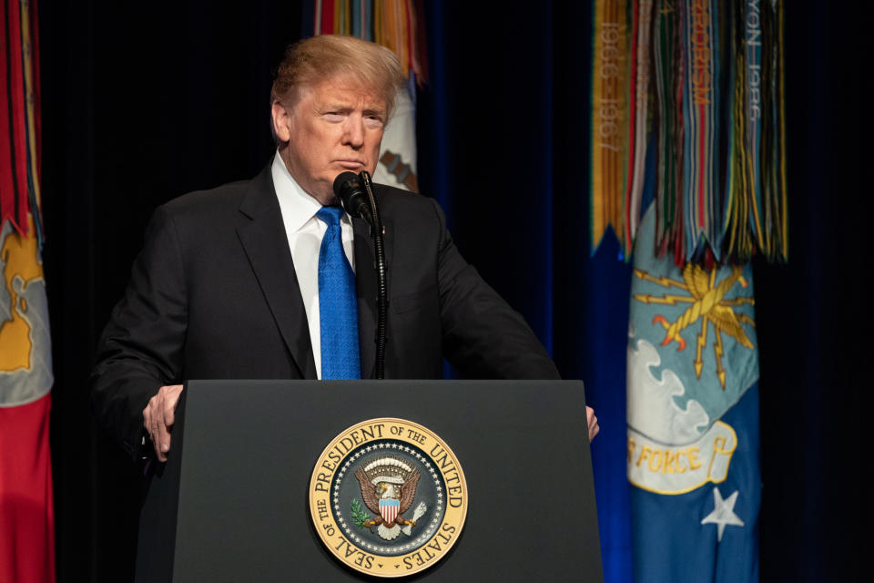 President Trump giving remarks from behind the presidential podium at the Pentagon.