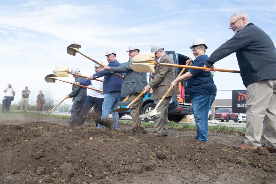 Officials with Shawnee County and members of the Topeka Pickleball Assocation do the honors of turning dirt during a groundbreaking ceremony for the new Family Park Wednesday morning.