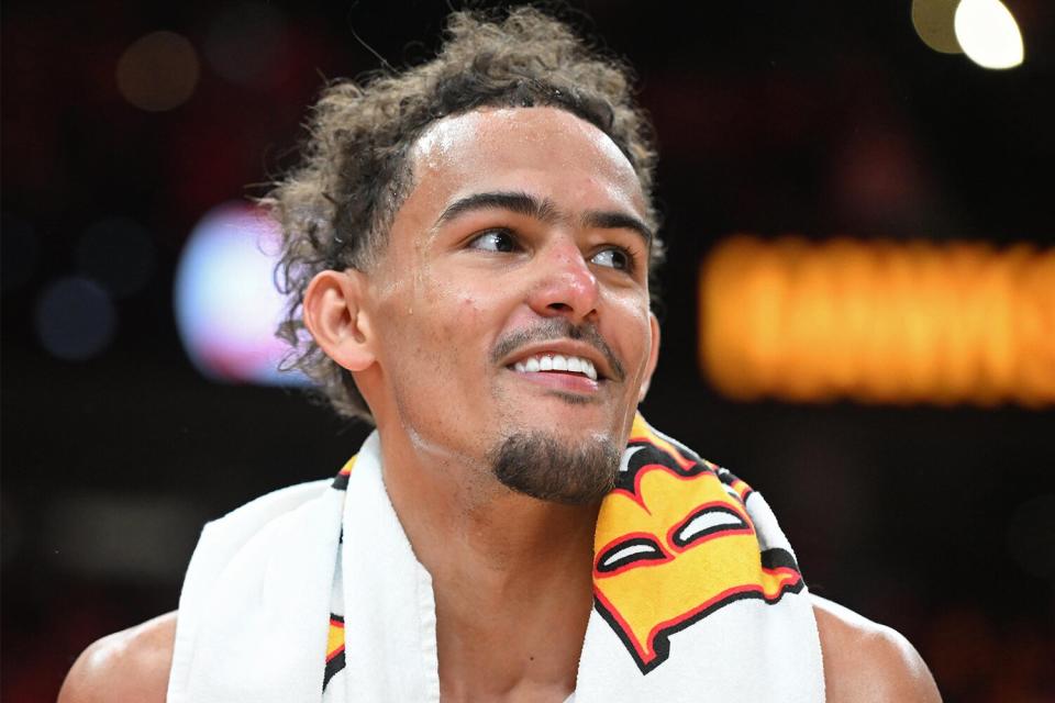 Trae Young #11 of the Atlanta Hawks smiles during the game against the Miami Heat during Round 1 Game 3 of the 2022 NBA Playoffs on April 22, 2022 at State Farm Arena in Atlanta, Georgia.