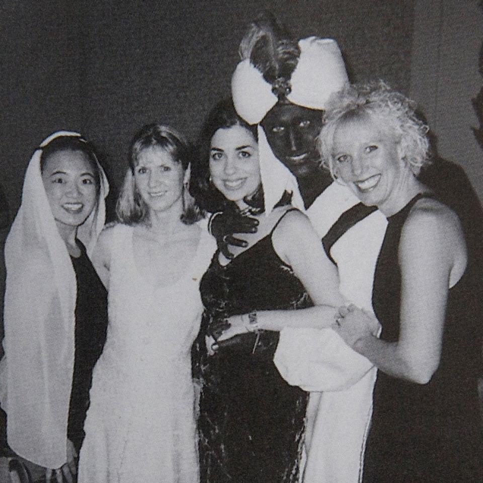 Justin Trudeau poses with others at an "Arabian Nights" party when he was a 29-year-old teacher at the West Point Grey Academy in Vancouver - Reuters