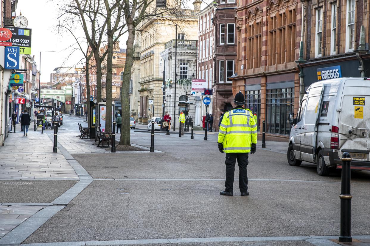 A police officer patrols an empty High Street in Worcester city centre, Worcestershire, on the first day of the third national lockdown in England, to reduce the spread of COVID-19. Prime Minister Boris Johnson announced further coronavirus restrictions during a televised address to the nation last night.