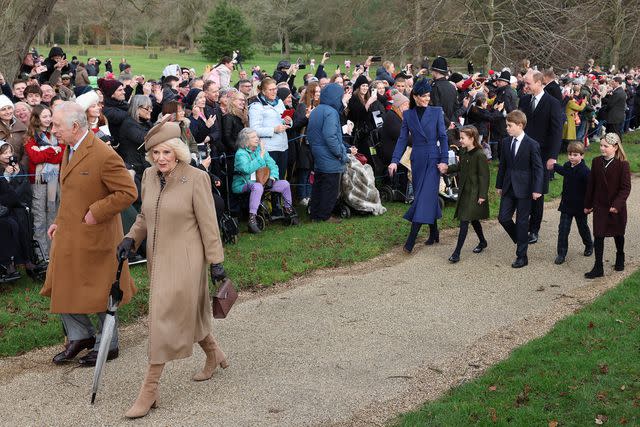 <p>ADRIAN DENNIS/AFP via Getty </p> King Charles and Queen Camilla lead royals at Christmas 2023