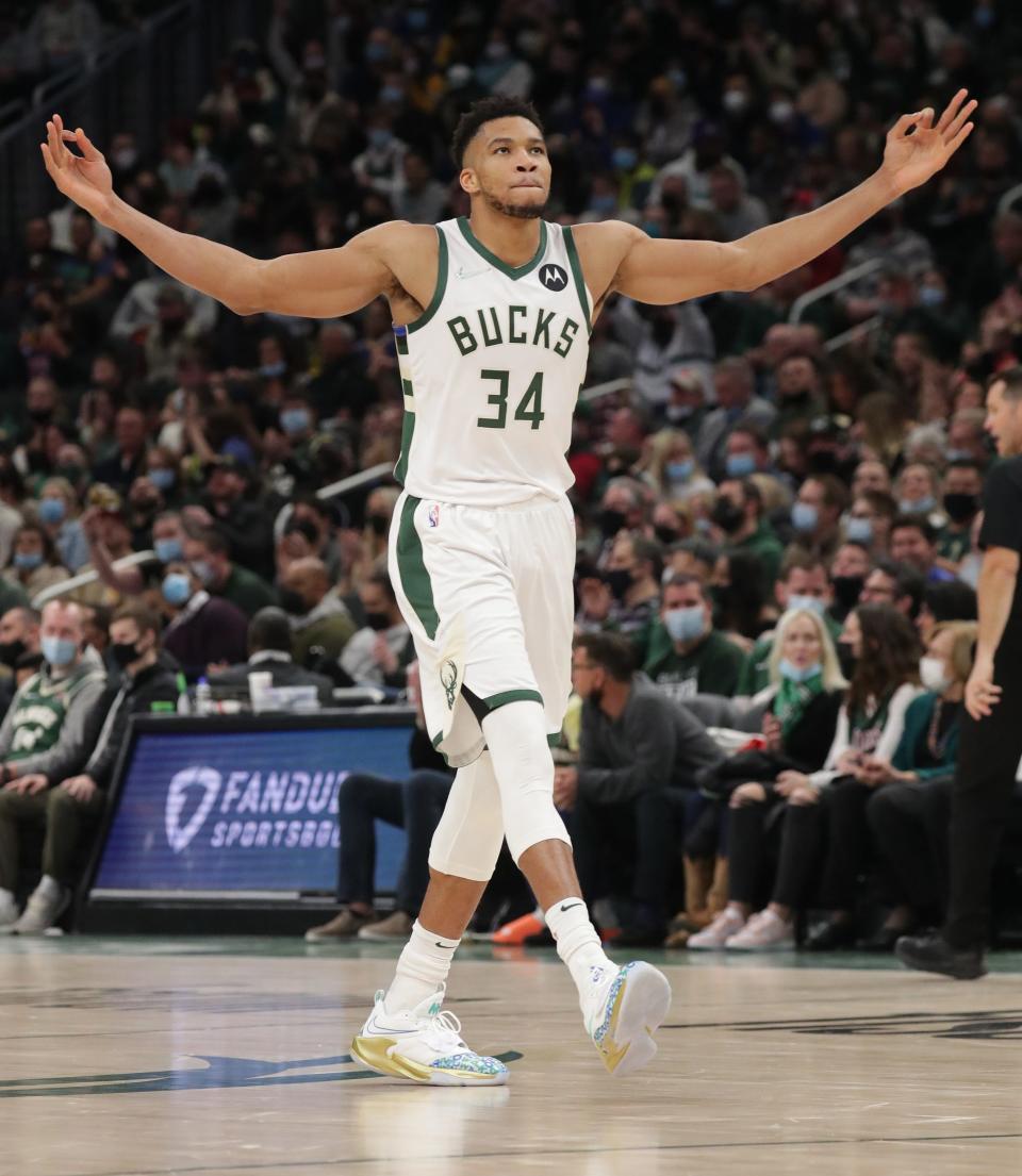 Milwaukee Bucks forward Giannis Antetokounmpo (34) celebrates a 3 point basket by teammate Milwaukee Bucks forward Jordan Nwora (13) during the second half of the Milwaukee Bucks 118-99 win over the Golden State Warriors at Fiserv Forum in Milwaukee on Thursday, Jan. 13, 2022. Photo by Mike De Sisti / The Milwaukee Journal Sentinel 