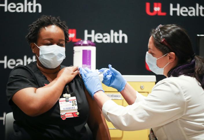 Nurse LaShawn Scott was one of the first people in Kentucky to receive the Pfizer COVID-19 vaccine on Monday, December 14, 2020.  The shot was administered by nurse Sarah Bishop at UofL Hospital.