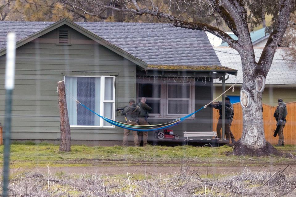 Investigators near the Gold Hill area of Jackson County, Oregon, carefully approach an illegal marijuana grow site, aware that growers are often armed.