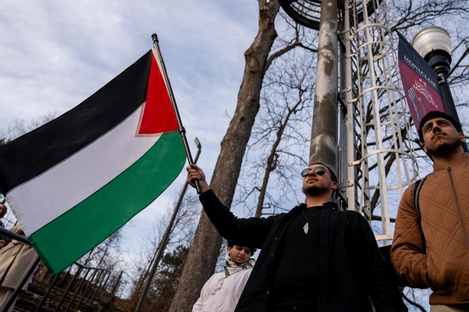 Mar 8, 2024; Montclair, NJ, United States; Mohammad Mohammad holds a Palestinian flag next to Muhanud Musa. New Jersey Students for Justice in Palestine hold a protest at Montclair State University after administrators withdrew approval for a fundraiser called "Palestine Lives." The fundraiser for humanitarian relief in Gaza was canceled the day before the event amid heightened scrutiny of pro-Palestinian activism on campus.