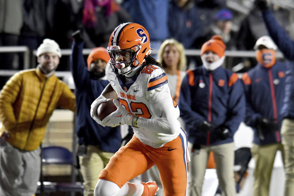 Syracuse's wide receiver Damien Alford runs for the go-ahead touchdown during the second half of an NCAA college football game against Boston College, Saturday, Nov. 26, 2022, in Boston. (AP Photo/Mark Stockwell)