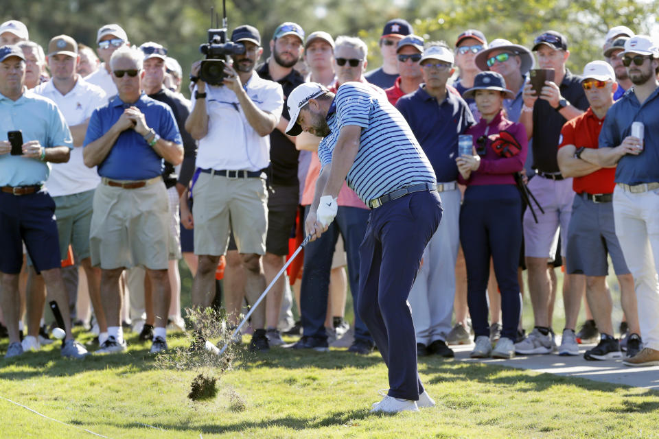 Marc Leishman hits out of the rough just in front of the gallery on the 16th fairway during the first round of the Houston Open golf tournament Thursday, Nov. 11, 2021, in Houston. (AP Photo/Michael Wyke)