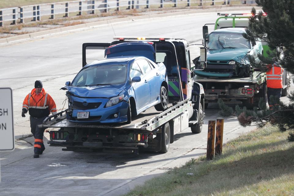 Work is done at the crash investigation area near the scene of a car accident on I-43 southbound just south of Capitol Drive in Milwaukee on Wednesday, Dec. 4, 2019.