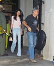 <p>For a casual look, Amal chose a pair of wide leg jeans and a light pink blouse.</p>