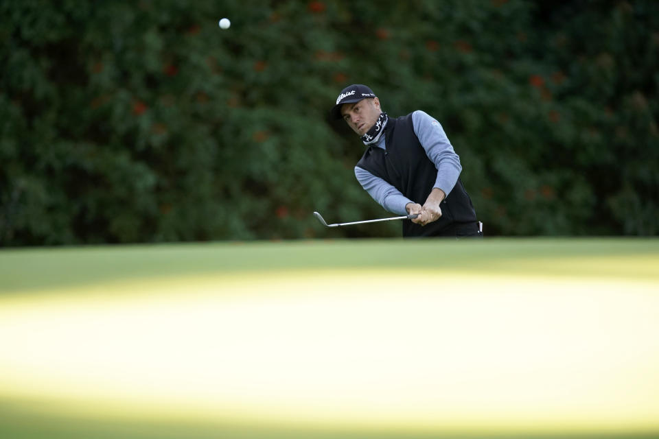 Justin Thomas chips onto the 12th green during the second round of the Genesis Invitational golf tournament at Riviera Country Club, Friday, Feb. 19, 2021, in the Pacific Palisades area of Los Angeles. (AP Photo/Ryan Kang)