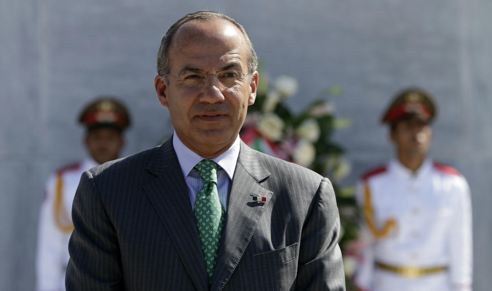 Mexico's President Felipe Calderon attends a wreath-laying ceremony at the Jose Marti monument in Havana, Cuba, Wednesday, April 11, 2012. Calderon is on a two-day official visit to Cuba. (AP Photo/Franklin Reyes)