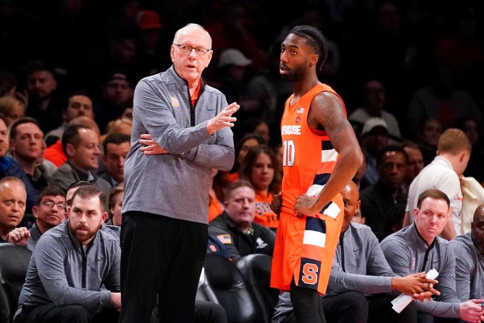 Syracuse head coach Jim Boeheim speaks with Symir Torrence (10) during a time out in the first half of an NCAA college basketball game at the Good Samaritan Empire Classic, Monday, Nov. 21, 2022, in New York. (AP Photo/John Minchillo)