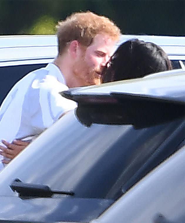 After months of hiding their romance, the couple enjoyed a public cuddle without caring who was watching. Photo: Mega Australia