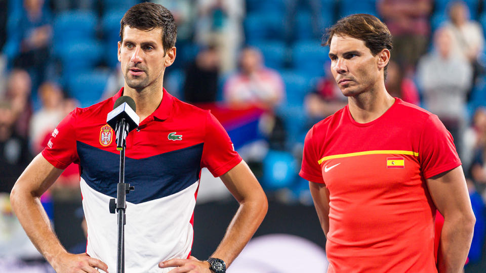 Novak Djokovic (pictured left) with his hands on his hips and Rafael Nadal (pictured right) look forward.