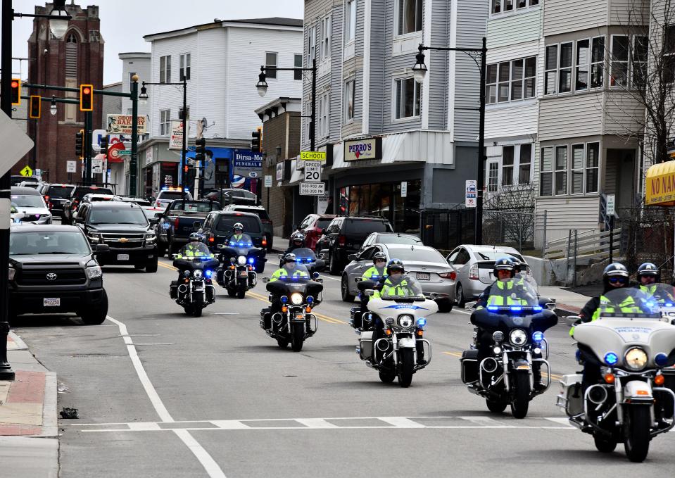 Members of the Central Mass. Law Enforcement Council ride motorcycles as they precede the funeral procession for Worcester Police Sgt. Derrick Leto from St. Stephen Church on Grafton Street Friday.