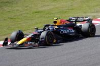 Red Bull driver Sergio Perez of Mexico steers his car during the Japanese Formula One Grand Prix at the Suzuka Circuit in Suzuka, central Japan, Sunday, April 7, 2024. (AP Photo/Hiro Komae)