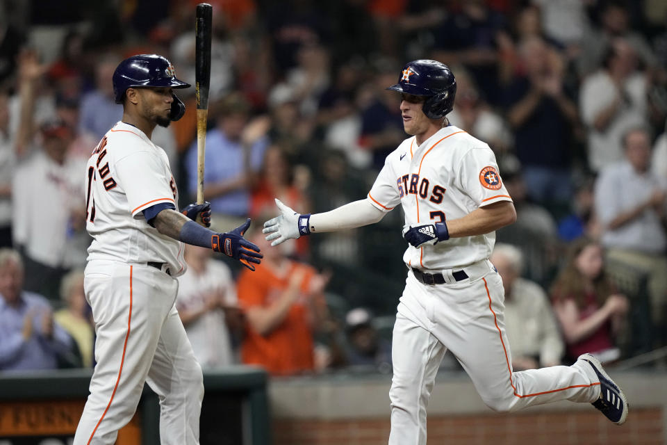 Houston Astros' Myles Straw (3) celebrates with Martin Maldonado after hitting a home run against the Texas Rangers during the fourth inning of a baseball game Wednesday, June 16, 2021, in Houston. (AP Photo/David J. Phillip)