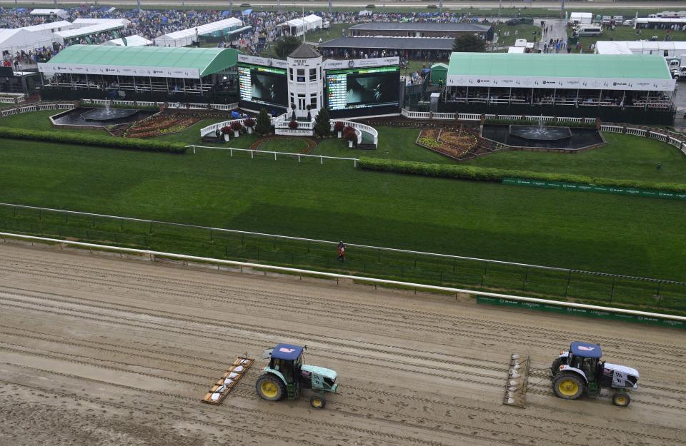 <p>Tractors groom the track before the 144th running of the Kentucky Derby at Churchill Downs in Louisville, Ky., May 5, 2018. (Photo: Jamie Rhodes/USA TODAY Sports/Reuters) </p>