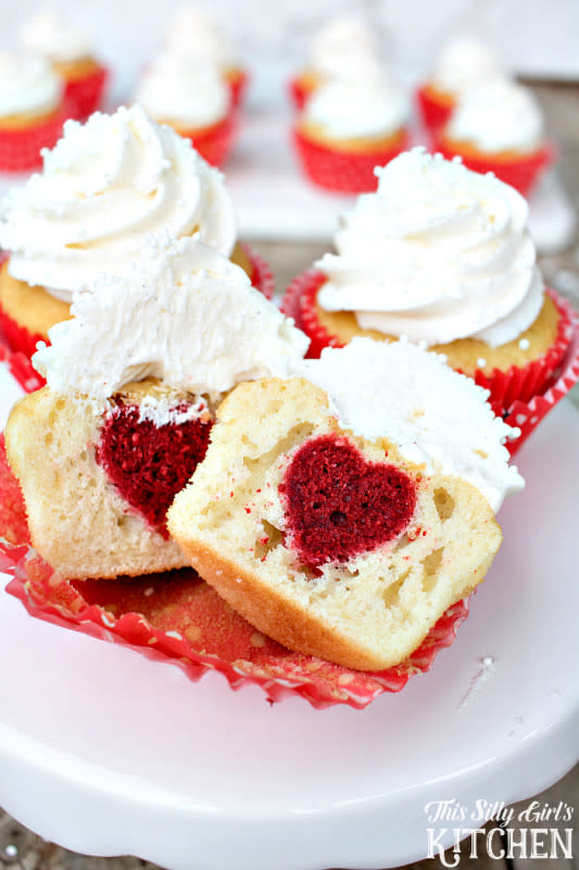 <p>The Silly Girl's Kitchen</p><p>Surprise Inside Heart Cupcakes, vanilla cupcakes with vanilla buttercream frosting, with a surprise red velvet heart inside!</p><p><strong>Get the recipe: <a href="https://thissillygirlskitchen.com/surprise-inside-heart-cupcakes/" rel="nofollow noopener" target="_blank" data-ylk="slk:Surprise Inside Heart Cupcakes;elm:context_link;itc:0;sec:content-canvas" class="link ">Surprise Inside Heart Cupcakes</a></strong></p>