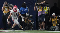 Georgia tight end Brock Bowers (19) celebrates his touchdown against Alabama during the second half of the Southeastern Conference championship NCAA college football game, Saturday, Dec. 4, 2021, in Atlanta. (AP Photo/Brynn Anderson)