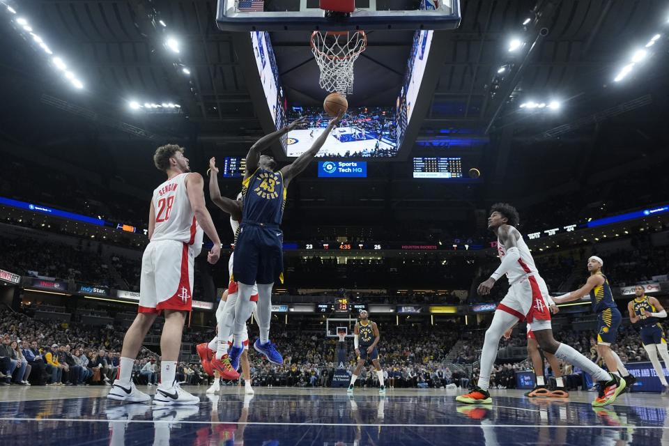 Indiana Pacers' Pascal Siakam (43) puts up a shot against Houston Rockets' Alperen Sengun (28) during the first half of an NBA basketball game, Tuesday, Feb. 6, 2024, in Indianapolis, (AP Photo/Darron Cummings)