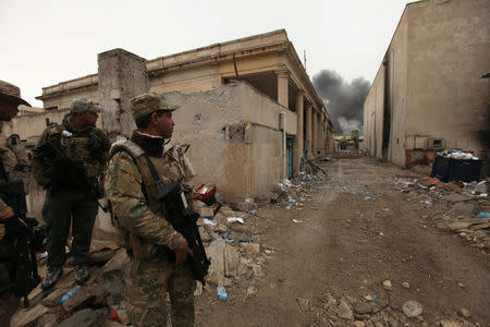 Members of Iraqi rapid response forces are pictured during clashes with Islamic State militants in Mosul, Iraq March 13, 2017. REUTERS/Azad Lashkari