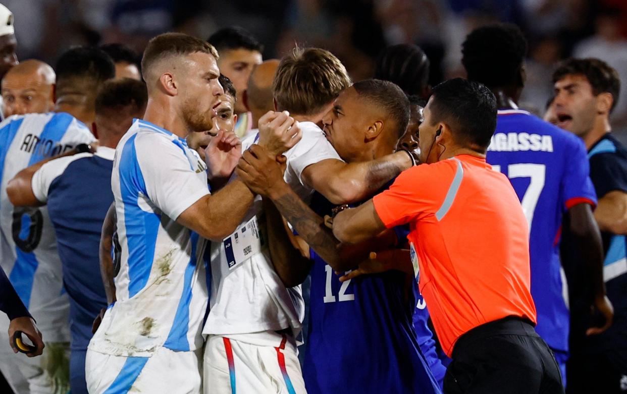 Enzo Millot of France and Lucas Beltran of Argentina clash referee Ilgiz Tantashev