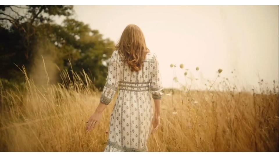 Kate Middleton walking through a field