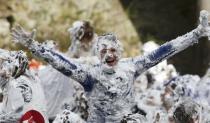 Students from St Andrews University are covered in foam as they take part in the traditional 'Raisin Weekend' in the Lower College Lawn, at St Andrews in Scotland, Britain October 17, 2016. REUTERS/Russell Cheyne