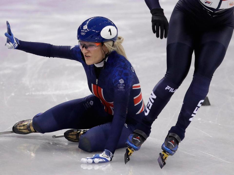 Elise Christie was disqualified from the 1000m short-track speedskating heats (AP)