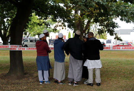 Muslims are seen near a police line outside Masjid Al Noor mosque in Christchurch, New Zealand, March 17, 2019. REUTERS/Jorge Silva