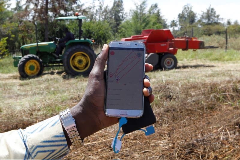 A mobile phone application shows movements of a John Deere 5503 tractor, installed with the Hello Tractor technology that connects farmers with vehicles' owners, in Umande village in Nanyuki