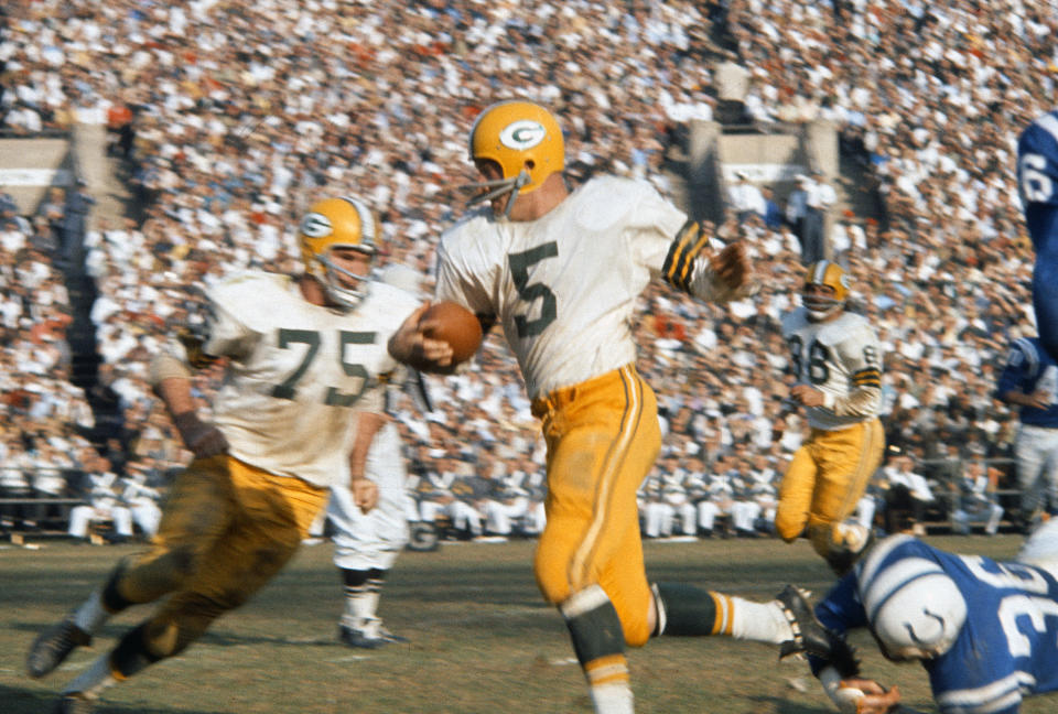 BALTIMORE, MD - OCTOBER 28:  Running back Paul Hornung #5 of the Green Bay Packers carries the ball against the Baltimore Colts during an NFL football game October 28, 1962 at Memorial Stadium in Baltimore, Maryland. Horning played for the Packers from 1957-66. (Photo by Focus on Sport/Getty Images) 