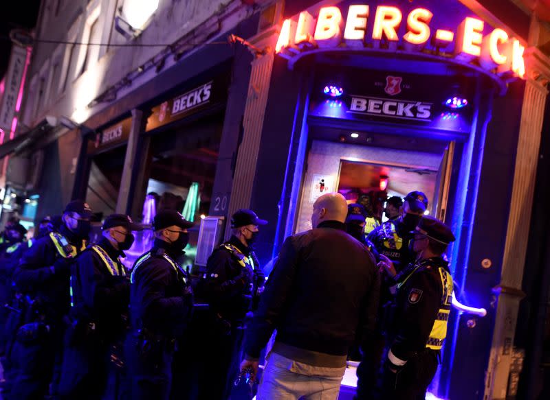 Police controls ID's and guest lists due to restrictions against the spread of the coronavirus disease (COVID-19) at a pub at famous red-light-district Reeperbahn in Hamburg