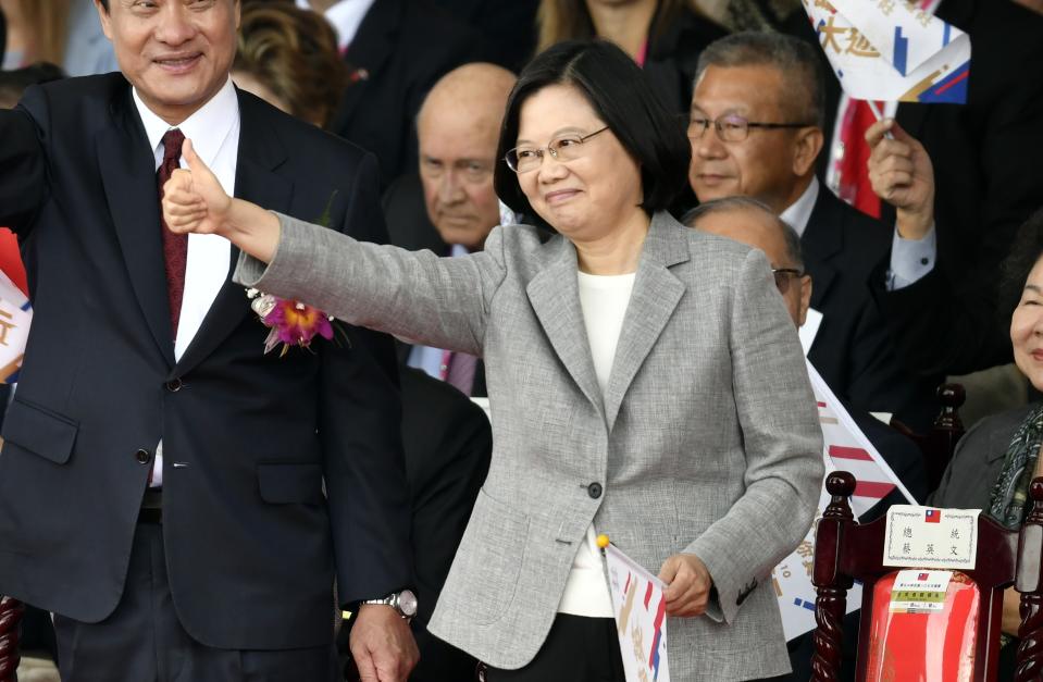 Taiwan's President Tsai Ing-wen (C) gestures as she attends National Day celebrations in front of the Presidential Palace in Taipei on October 10, 2018. - Taiwan's President Tsai Ing-wen accused China of "seriously challenging" peace and stability on October 10, describing the island she leads as being on the frontline of tensions in the Pacific. (Photo by SAM YEH / AFP)        (Photo credit should read SAM YEH/AFP/Getty Images)