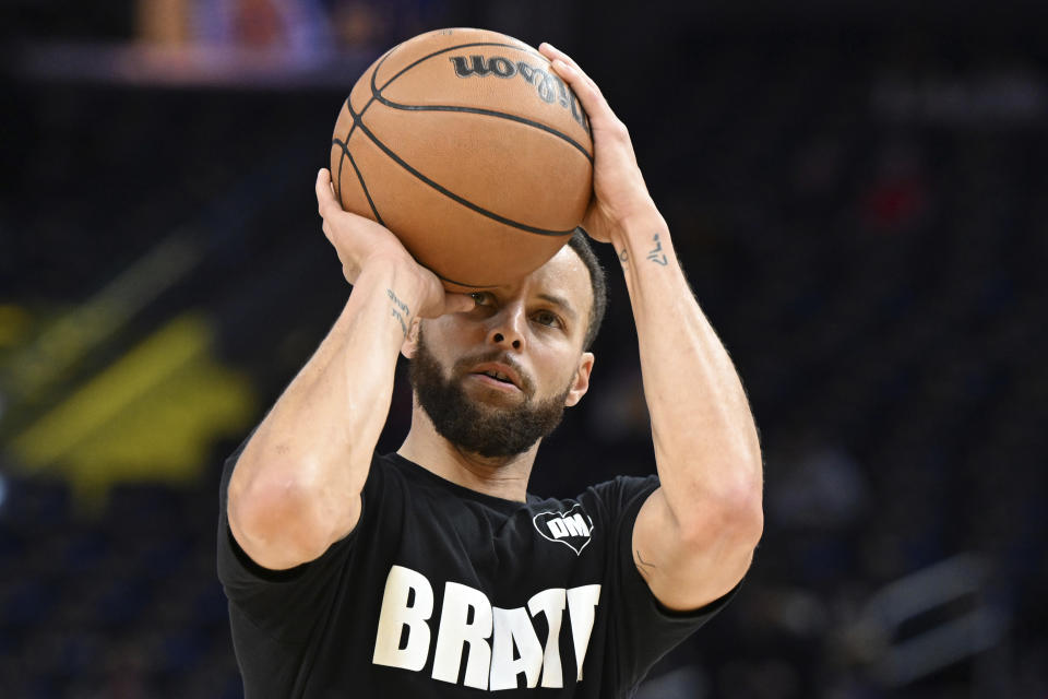 Golden State Warriors guard Stephen Curry warms up before an NBA basketball game against the Los Angeles Lakers, Saturday, Jan. 27, 2024, in San Francisco. (AP Photo/Nic Coury)