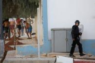 Protesters throw stones towards riot police during a demonstration against alleged corruption in the town of Al-Hoceima, Morocco July 20, 2017. REUTERS/Youssef Boudlal